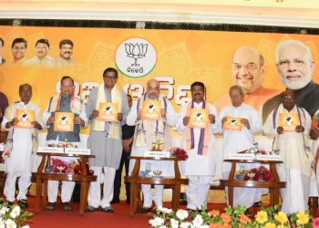 BJP president Amit Shah (C) and other party leaders from Odisha during the launch of the party manifesto in Bhubaneswar, Sunday