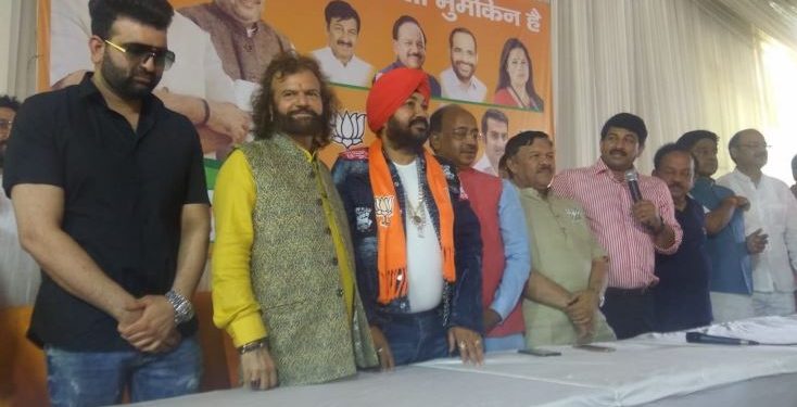 Former Indian cricket superstar Gautam Gambhir and Delhi BJP chief Manoj Tiwari were also present at the event when the Punjabi singing sensation joined the party. (Image: ANI/Twitter)