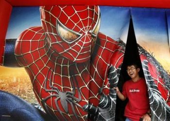 A man laughs as he comes out after watching Spiderman-3 promotional video in Hong Kong May 2, 2007. (REUTERS)