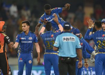 Mumbai Indians players celebrate their victory over Sunrisers Hyderabad by throwing Alzarri Joseph in the air after his six-wicket haul