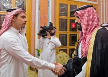 Saudi Crown Prince Mohammed bin Salman, right, shakes the hand of Salah Khashoggi, son of slain journalist Jamal Khashoggi, in Riyadh in October 2018 (AFP)