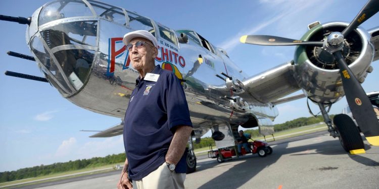 In this April 16, 2013 file photo, Doolittle Raider Lt. Col. Dick Cole, stands in front of a B-25 at the Destin Airport in Destin, Fla. before a flight as part of the Doolittle Raider 71st Anniversary Reunion. Retired Lt. Col. Richard "Dick" Cole, the last of the 80 Doolittle Tokyo Raiders who carried out the daring U.S. attack on Japan during World War II, has died at a military hospital in Texas. He was 103. A spokesman says Cole died Tuesday, April 9, 2019, at Brooke Army Medical Center in San Antonio, Texas. (Nick Tomecek/Northwest Florida Daily News via AP)