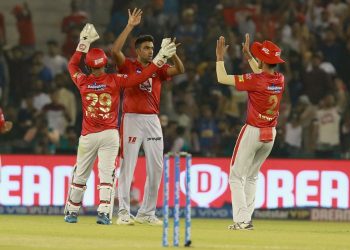 R Ashwin (C) celebrates with teammates after dismissing an opposition batsman, Tuesday