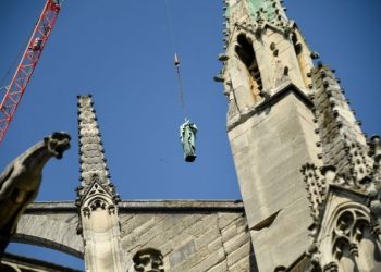 Tourists at the world-famous landmark were left stunned Thursday as the statues -- representing the 12 apostles and the four evangelists from the New Testament -- were lifted off the spire of the cathedral by crane. (Image: Yahoo)