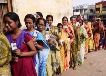 Voters queue up at a polling station in West Bengal