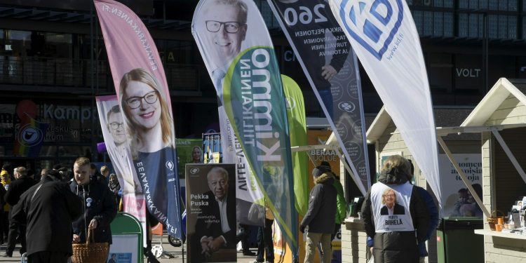 Different parties campaigning for parliamentary elections on the Narinkkatori Square in Helsinki, Finland, on Friday, April 12, 2019. The election day of the Finnish parliamentary elections is on Sunday, April 14, 2019. (Markku Ulander/Lehtikuva via AP)