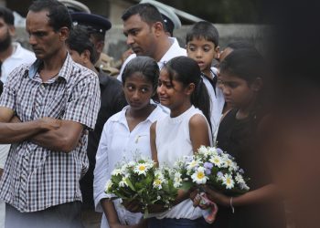 Negombo: Friends of Dhami Brandy, 13, who was killed during Easter Sunday's bomb blast at St. Sebastian Church, cries during funeral service in Negombo, Sri Lanka Thursday, April 25, 2019. The U.S. Embassy in Sri Lanka warned Thursday that places of worship could be targeted for militant attacks over the coming weekend, as police searched for more suspects in the Islamic State-claimed Easter suicide bombings that killed over 350 people. AP/PTI(AP4_25_2019_000164B)