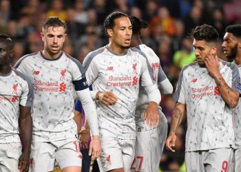 Liverpool players react after their loss to Barcelona, Wednesday