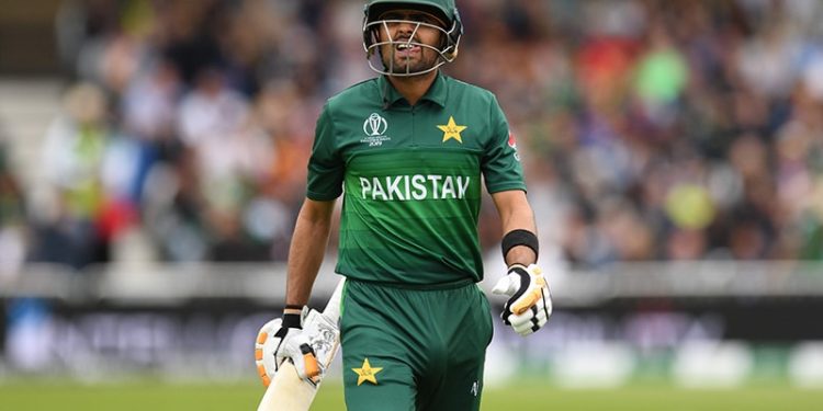 Babar Azam walks back to the pavilion after getting out for 22.