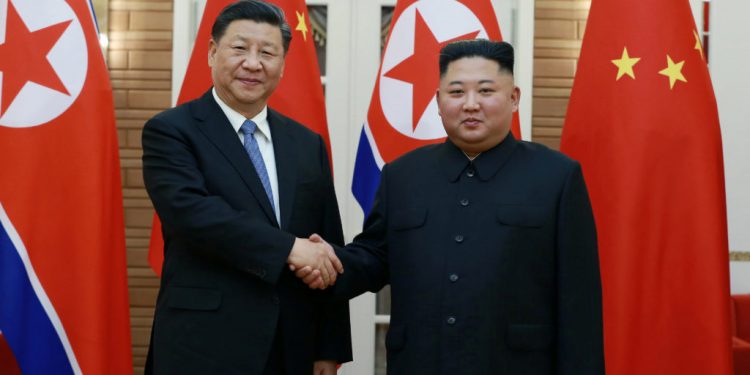 Xi-Jinping with North Korea leader Kim Jong-un.