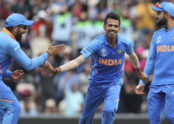 Yuzvendra Chahal (centre) celebrates with Rohit Sharma and Virat Kohli after dismissing a South African batsman, Wednesday