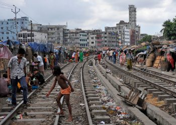 Homes beside the railroad tracks in Dhaka, Bangladesh