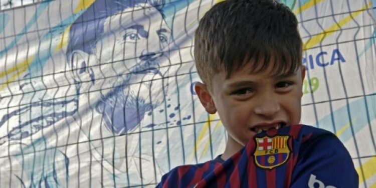 he six-year-old from Alvorada, a suburb of Porto Alegre, is waiting at the gates of the Beira Rio stadium alongside his mother Lisiana Maier, hoping to speak to Barcelona and Argentina superstar Messi.