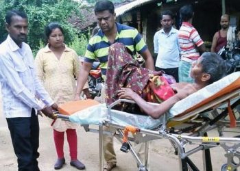 Biranchi Tandi being carried on a stretcher to the hospital