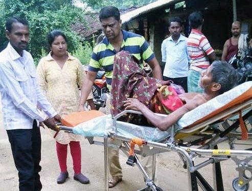 Biranchi Tandi being carried on a stretcher to the hospital