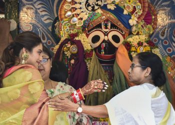 West Bengal CM Mamata Banerjee with newly elected Trinamool MP and film actress Nusrat Jahan during ISKCON's Rath Yatra event, Thursday. PTI