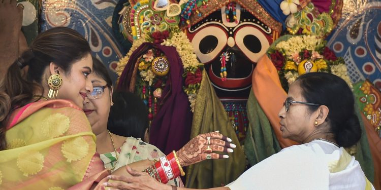 West Bengal CM Mamata Banerjee with newly elected Trinamool MP and film actress Nusrat Jahan during ISKCON's Rath Yatra event, Thursday. PTI