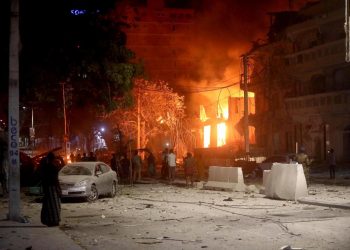 A suicide bomber rammed a vehicle loaded with explosives into the Medina hotel in the port town of Kismayo Friday before several heavily armed gunmen forced their way inside, shooting as they went, authorities said.