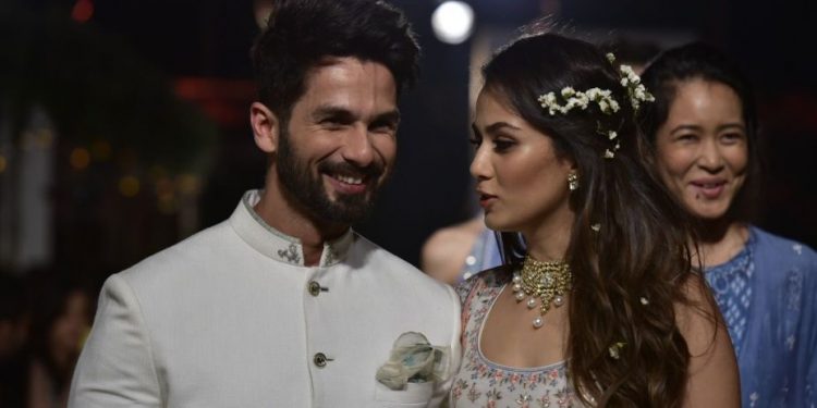 Mumbai: Actor Shahid Kapoor with his wife Mira Rajput walk the ramp for fashion designer Anita Dongre during the Lakme Fashion Week Summer/Resort 2018 in Mumbai on Jan 31, 2018. (Photo: IANS)