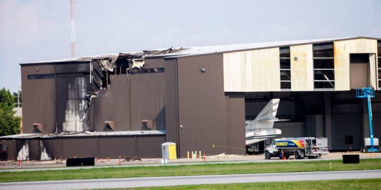 The Beechcraft BE-350 King Air hit an unoccupied hangar soon after 9 am, according to the Federal Aviation Administration.