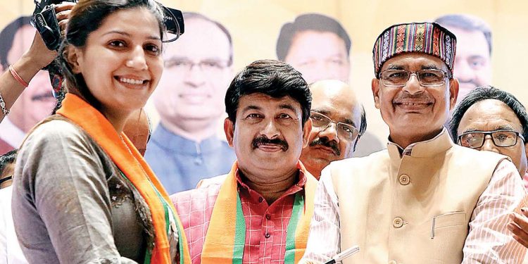 From left: Sapna Chaudhary, Manoj Tiwari and Shivraj Singh Chouhan during a function