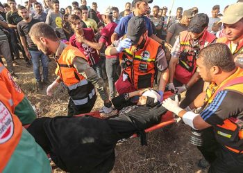 The ministry said another Palestinian was hospitalised in the shooting that came after the Israeli army said an attack helicopter and tank had fired at ‘armed suspects’ along the barrier that separates Israel from Gaza.