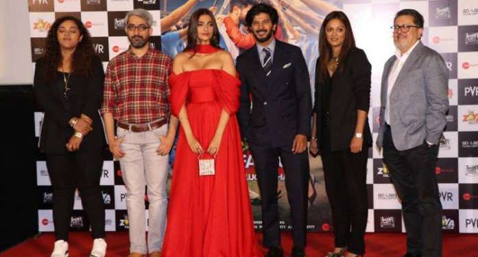 Sonam Kapoor (in red) with Dulquer Salmaan to her left