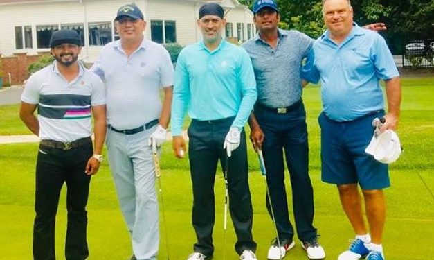 Sporting his new bandana look Dhoni was seen flaunting his salt and pepper look with a club in hand alongside Jadhav on the latter's Instagram post.