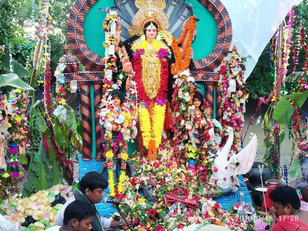 Currency garlands for goddess of snakes