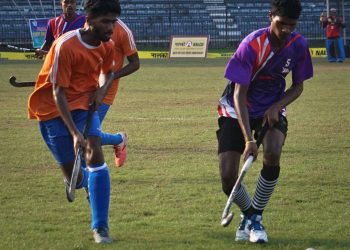 Players vie for the ball during the Sports Hostel versus Ganjam game