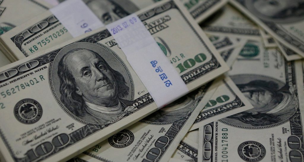 Dollar dips modestly amid jobs data