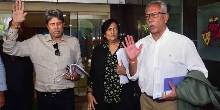 Mumbai: Former India captain Kapil Dev, who is the Chairman of Cricket Advisory Committee, along with Anshuman Gaekwad and Shantha Rangaswamy leave the BCCI headquarters after conducting interviews for team India head coach post, in Mumbai, Friday, Aug. 16, 2019.  (PTI Photo/Shashank Parade)(PTI8_16_2019_000083B)