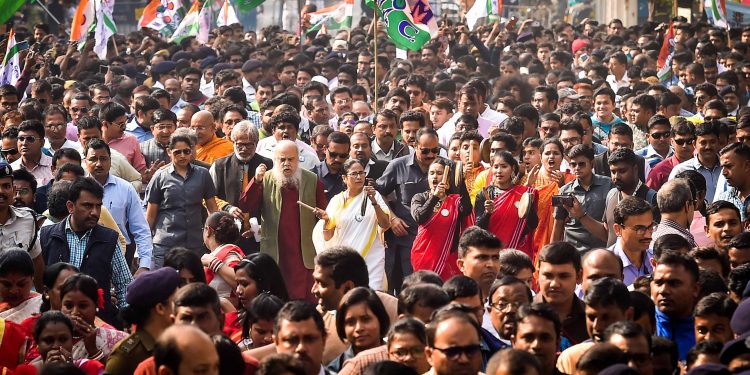 TMC supremo and West Bengal chief minister Mamata Banerjee walks with the during a protest rally against NRC and CAA in Kolkata, Thursday