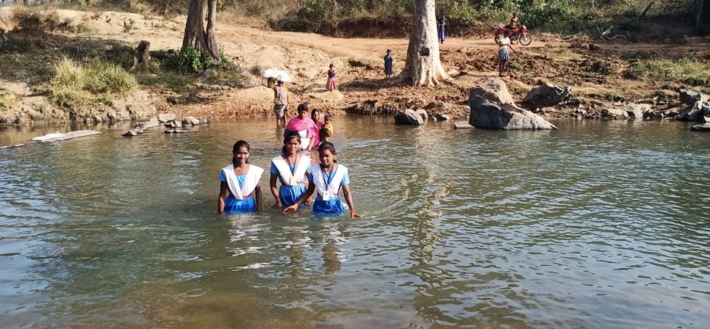 Crossing river routine for these school-going kids