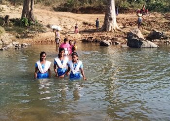 Crossing river routine for these school-going kids