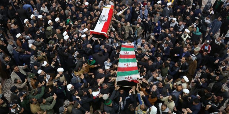 Mourners carry the coffins of Iran's Gen. Qassem Soleimani and Abu Mahdi al-Muhandis, deputy commander of Iran-backed militias at the Imam Ali shrine in Najaf, Iraq, Saturday, Jan. 4, 2020. Iran has vowed "harsh retaliation" for the U.S. airstrike near Baghdad's airport that killed Tehran's top general and the architect of its interventions across the Middle East, as tensions soared in the wake of the targeted killing. (AP Photo/Anmar Khalil)