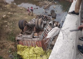 3 injured as paddy laden truck falls off bridge