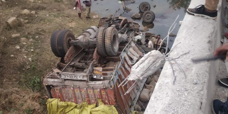 3 injured as paddy laden truck falls off bridge