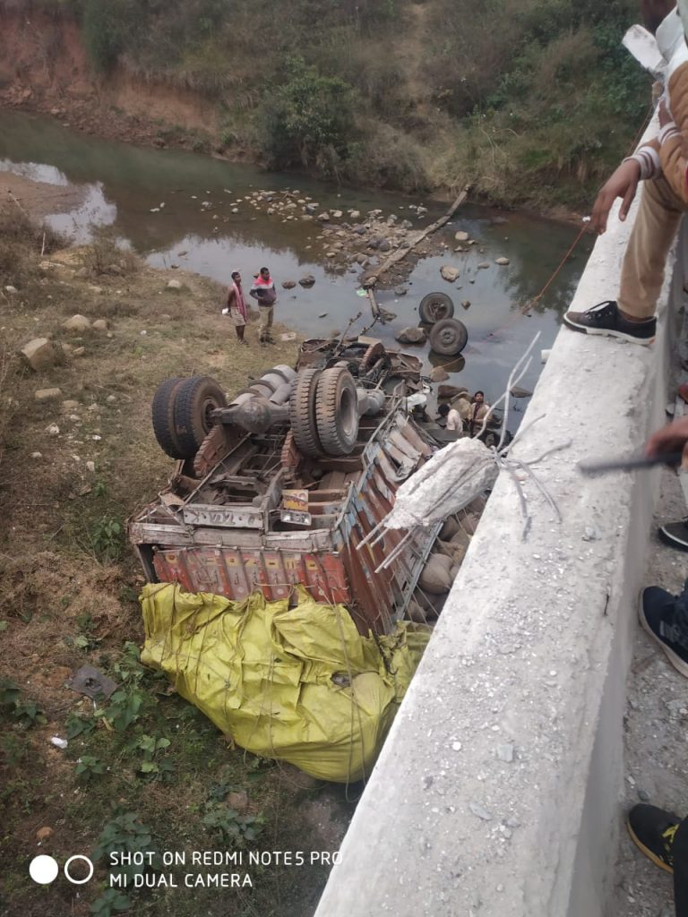 3 injured as paddy laden truck falls off bridge