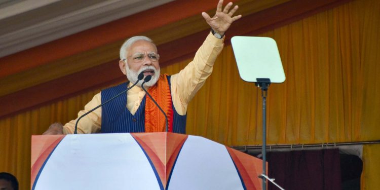 Prime Minister Narendra Modi addresses a public rally during an event to celebrate the signing of the Bodo agreement, in Kokrajhar, Assam