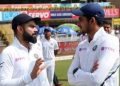 Shubman Gill (R) with captain Virat Kohli