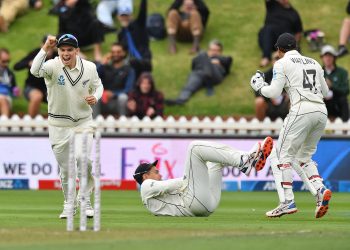 Ross Raylor (on ground) made his 100th Test memorable by catching Virat Kohli