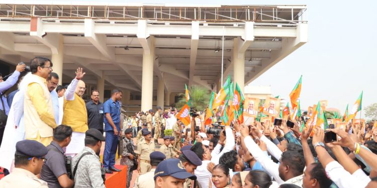 Union Home Minister Amit Shah waves to the crowd outside the BPIA, Friday