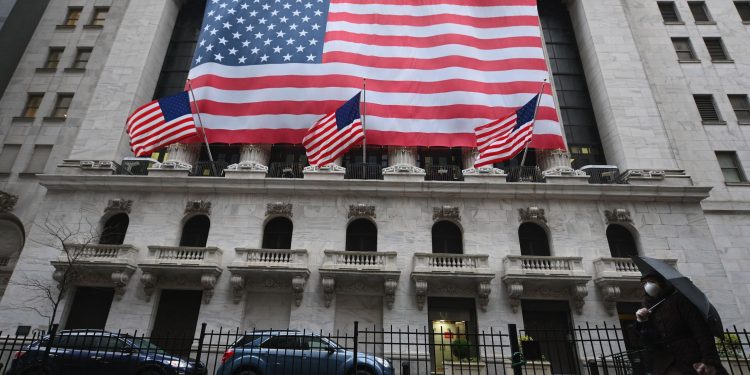 View of New York Stock Exchange, Wall Street on March 23, 2020 in New York City. - Wall Street fell early March 23, 2020 as Congress wrangled over a massive stimulus package while the Federal Reserve unveiled new emergency programs to boost the economy including with unlimited bond buying. About 45 minutes into trading, the Dow Jones Industrial Average was down 0.6 percent at 19,053.17, and the broad-based S&P 500 also fell 0.6 percent to 2,290.31 after regaining some ground lost just after the open. (Photo by Angela Weiss / AFP) (Photo by ANGELA WEISS/AFP via Getty Images)