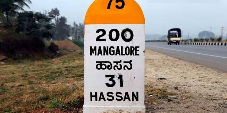 Why do roads in India have colored milestones?