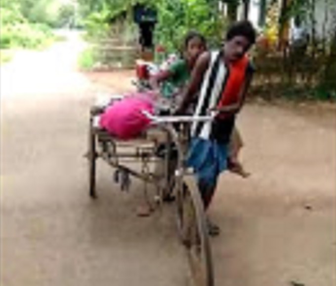 Deprived of hospital help family members carry deceased’s body on trolley