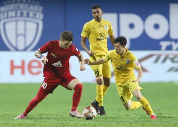 NEUFC's Federico Gallego and MCFC's Cy Goddard in action in match 2 of ISL 7 at the Tilak Maidan Stadium, Vasco. Pic - IANS