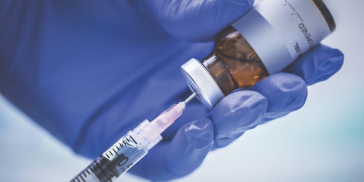 A stock photo of a Nurse preparing a vaccination