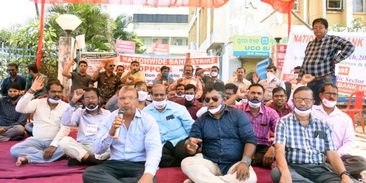 Protesting bankers holding a sit-in as part of a nationwide bank strike in front of UCO Bank at Master Canteen in Bhubaneswar (File photo)