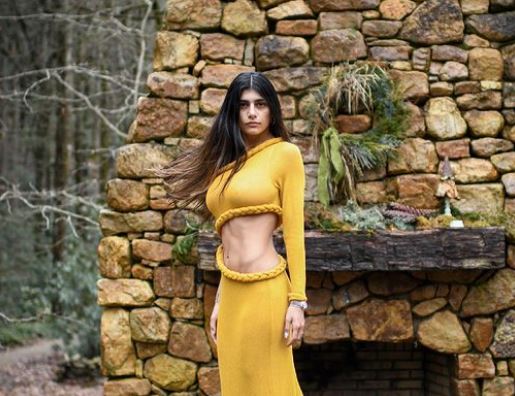 Mia Khalifa strikes a pose in cut-out mustard-colored dress - OrissaPOST